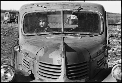 Boy in Pickup, a photograph by Brian Lanker